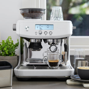 Breville Barista Pro Espresso Machine in Sea Salt White on Countertop near window