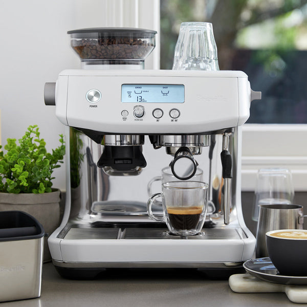 Breville Barista Pro Espresso Machine in Sea Salt White on Countertop near window